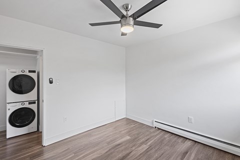 A room with a washer and dryer in it.