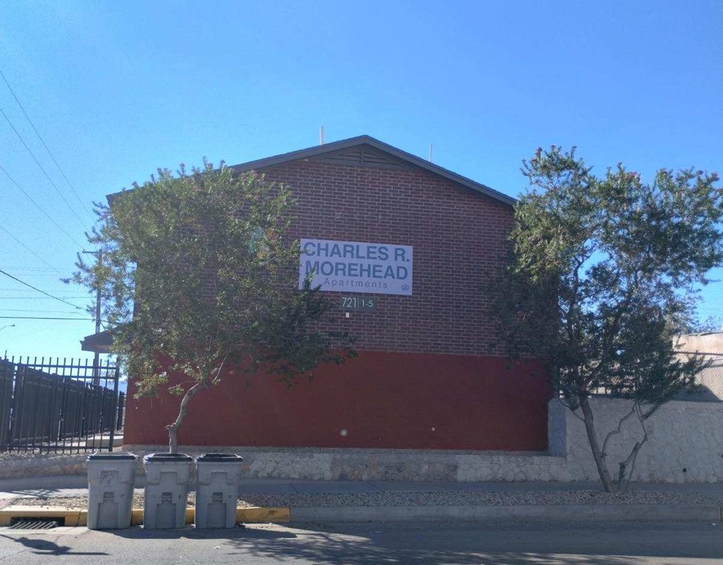 A red building with a sign that says Charles R Morhead.