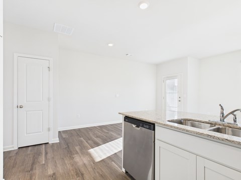 A kitchen with a dishwasher and sink.