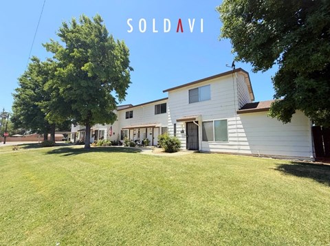 A house with the word "SOLD" written on it.