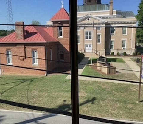 A view of a building through a window.