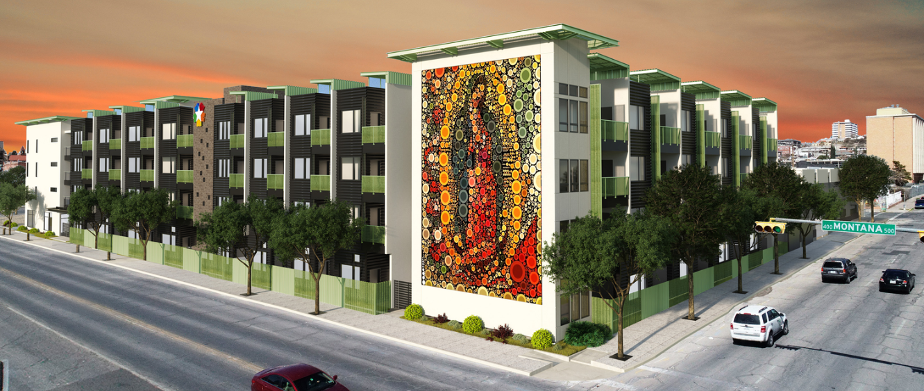 A street view of a building with a large mural on the side.