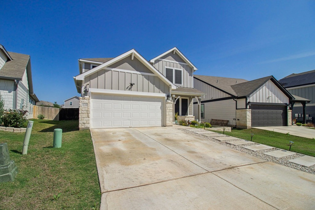 A house with a driveway in front of it.