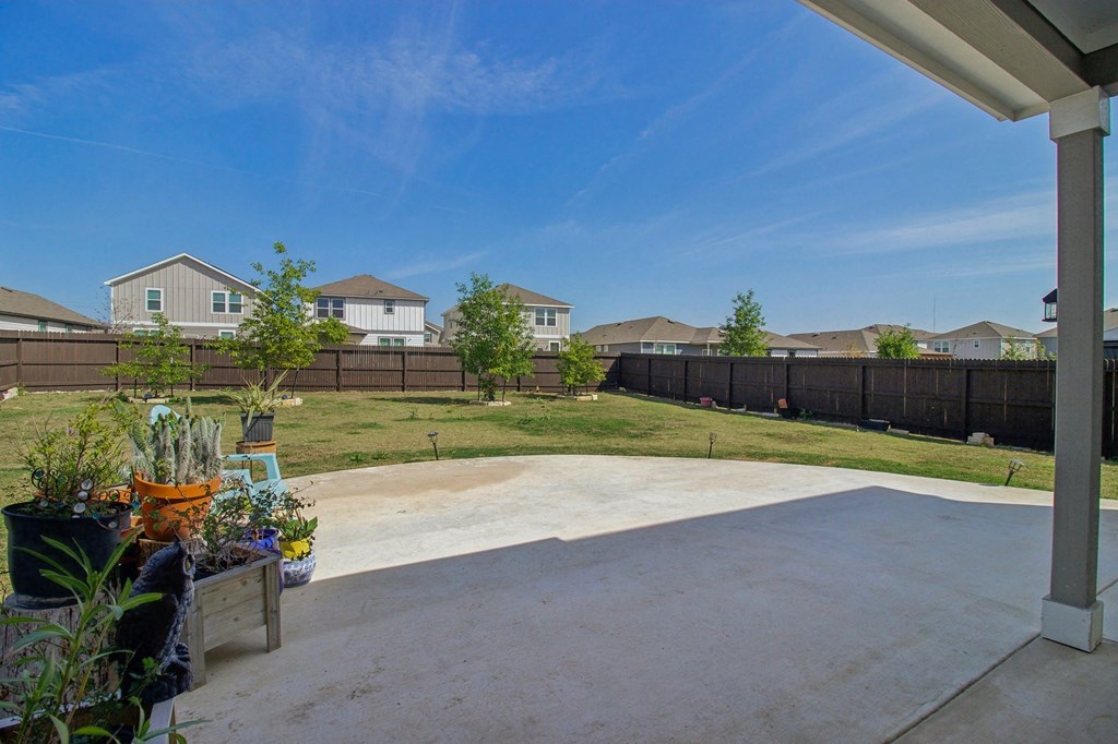 A residential area with houses and a clear sky.