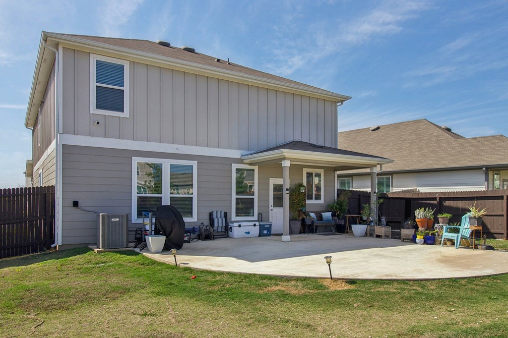 A house with a grey exterior and a white roof.