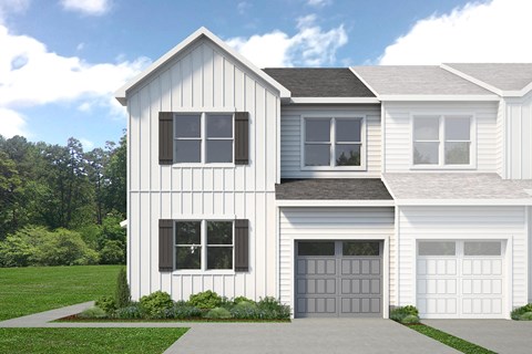 A two-story house with a white exterior and a grey garage door.