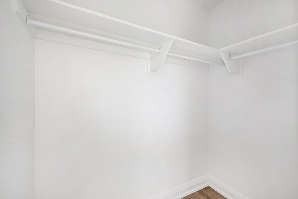 A white wall with a white floor and white ceiling.