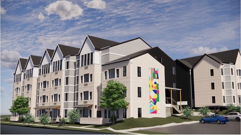 A modern apartment building with a colorful mural on the side.