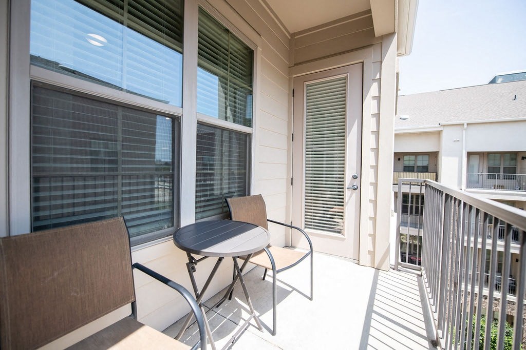 A patio with a table and chairs is shown.