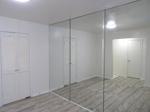 A room with a glass partition and white walls.