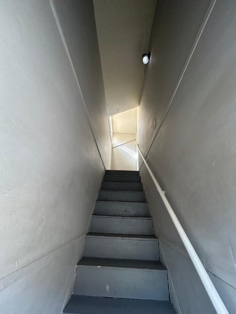 A stairway with a light at the top.