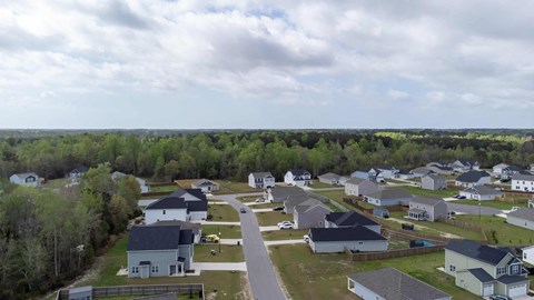 A suburban neighborhood with houses and trees.