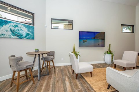 A living room with a wooden table and chairs.