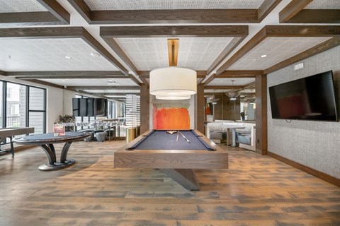 A bowling alley is set up in a modern room.