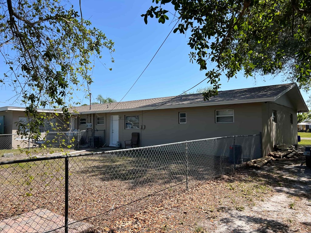 A house with a fence in front of it.