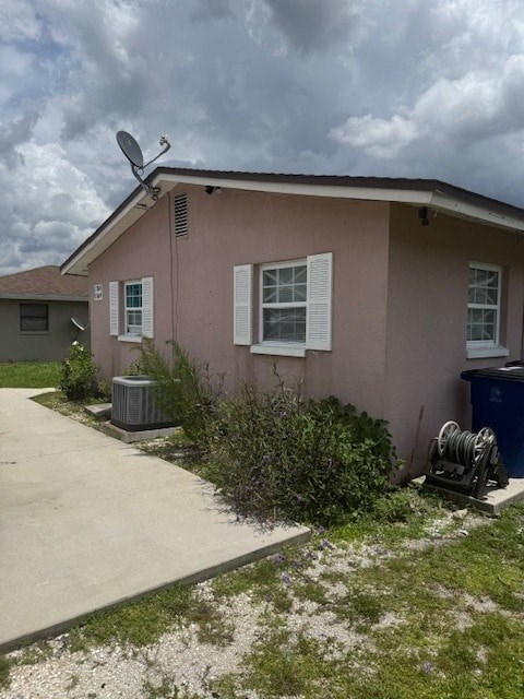 A house with a satellite dish on the roof.