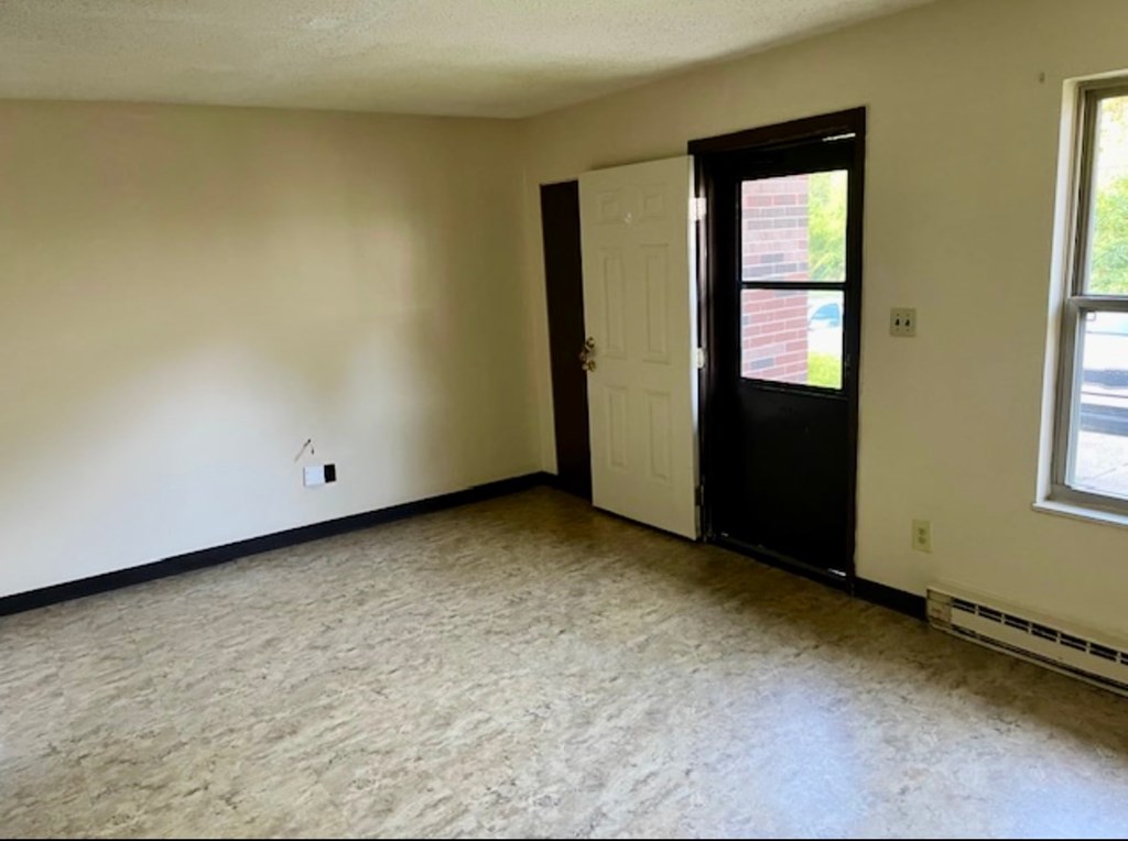 A room with a door and a window.