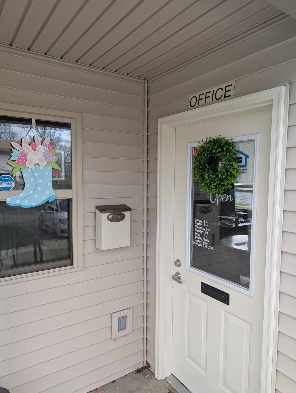 A white door with a sign that says "OFFICE" above it.