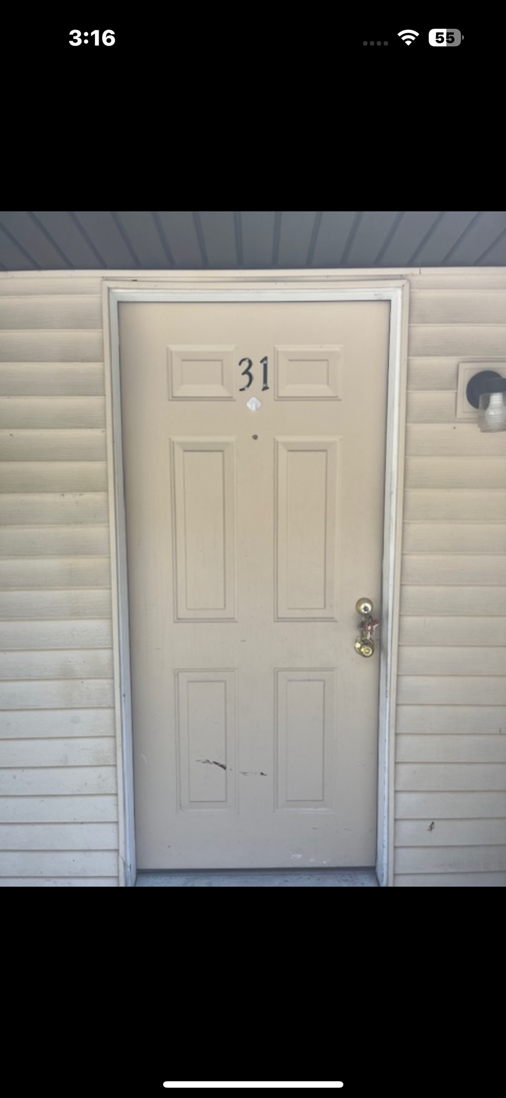A white door with the number 31 on it.