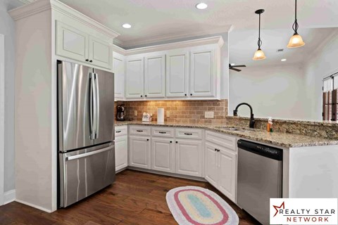A kitchen with a Realty Star Network logo.