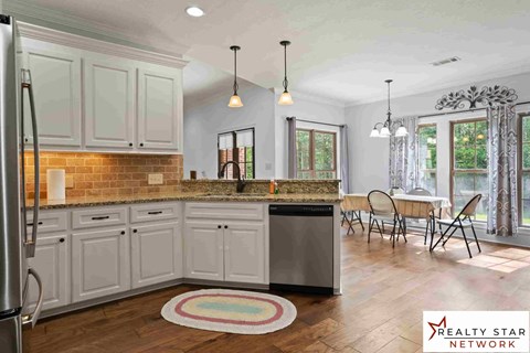 A kitchen with Realty Star Network logo.