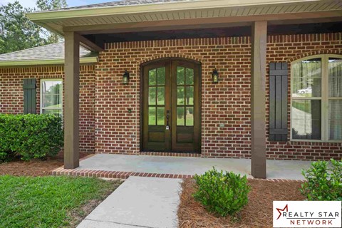 A house with a Realty Star Network logo.