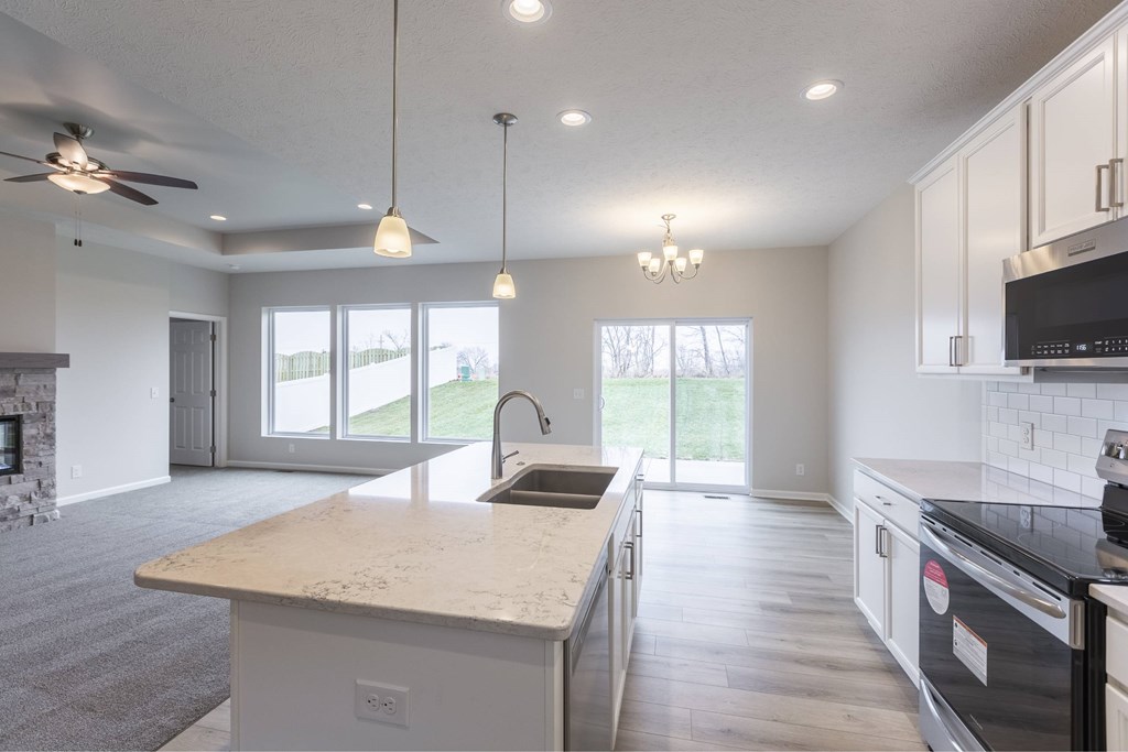 A modern kitchen with a large island in the middle.
