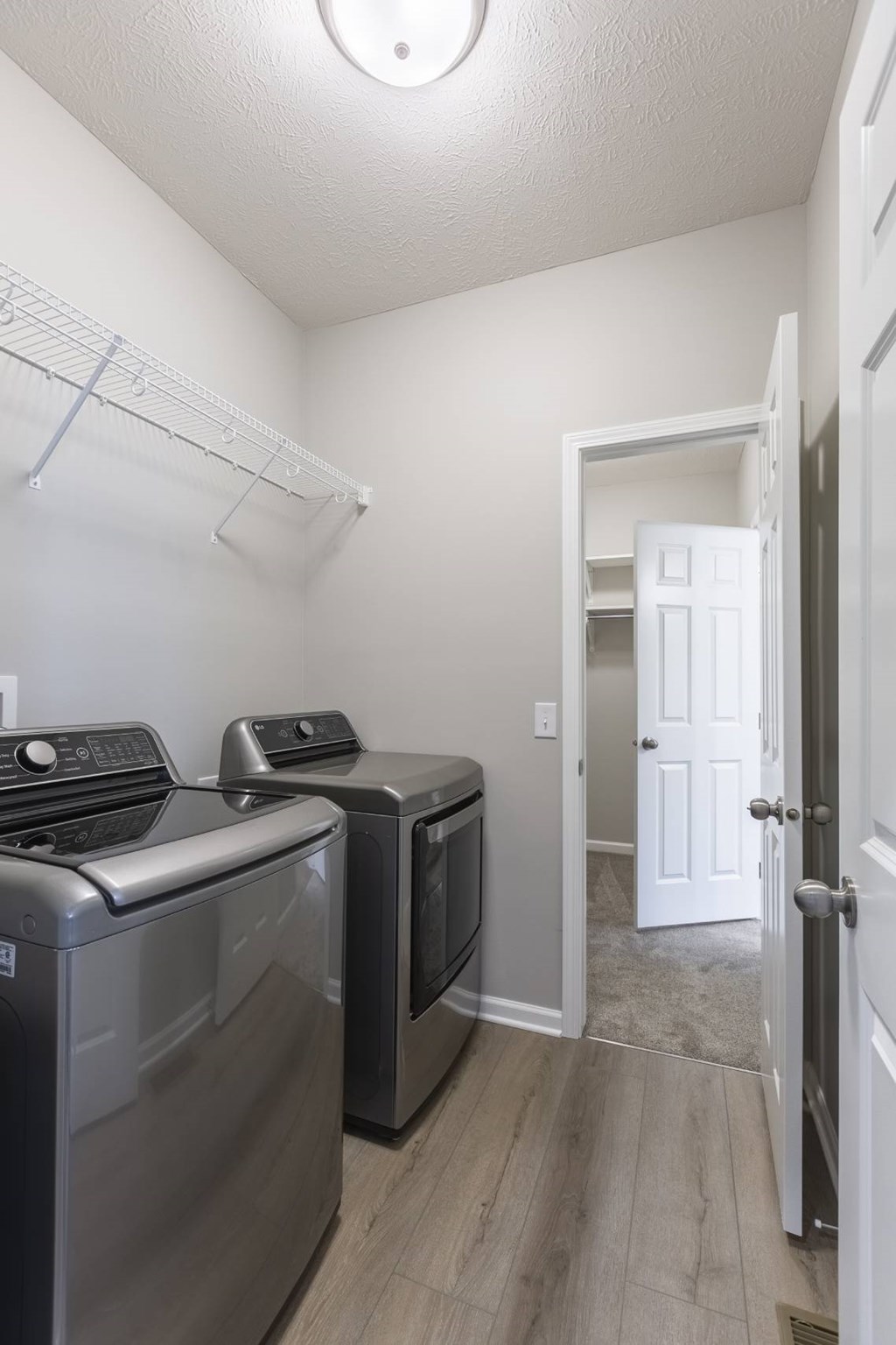 A laundry room with a washer and dryer.
