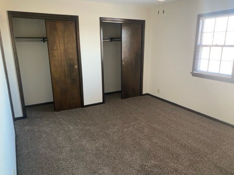 A room with two doors and a window.