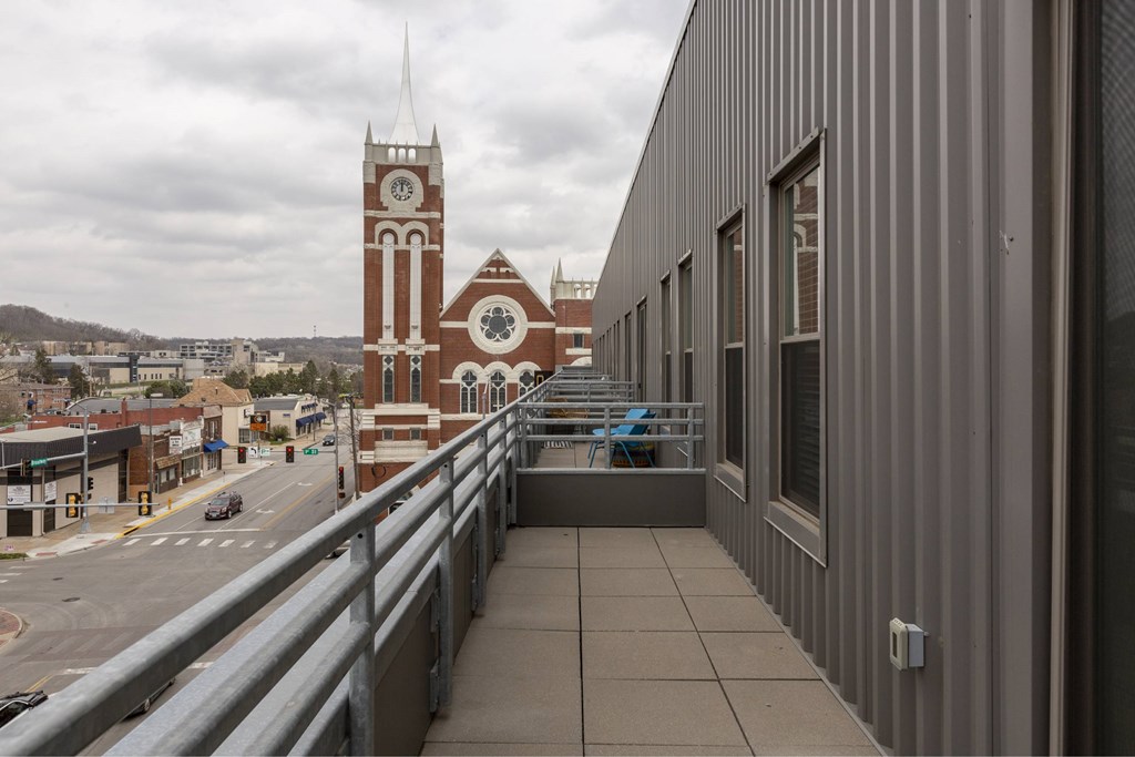 A view of a city street with a clock tower in the background.