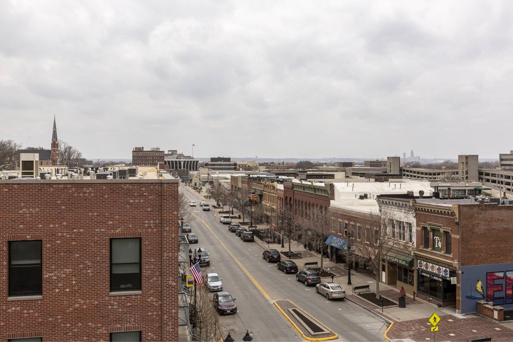 A city street with cars and buildings.