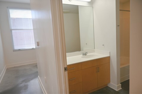 A bathroom with a sink and a mirror.