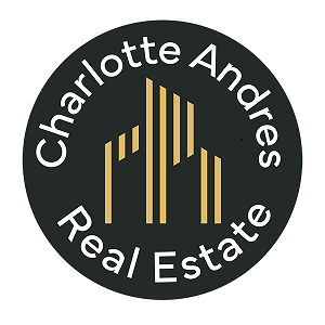 A logo for Charlotte Andres Real Estate features a stylized mountain.