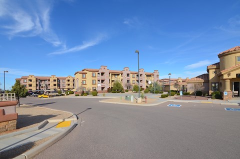 A sunny day at a residential complex with a clear blue sky.