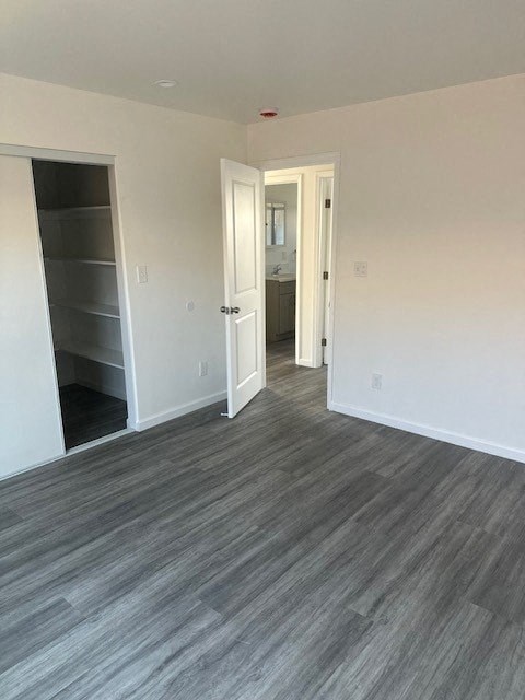 A room with a grey floor and white walls.