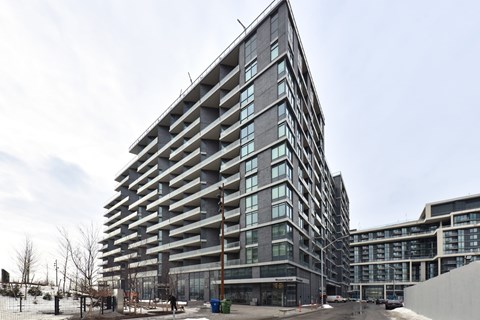 A modern building with a lot of windows and balconies.