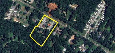 A yellow square highlights a section of a satellite image showing a residential area.