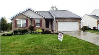 A house with a "For Sale" sign in front of it.