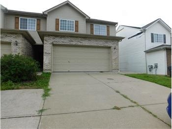 A house with a garage and a driveway.