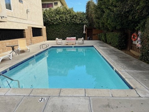 A small pool with a 3/8 inch marking on the side.