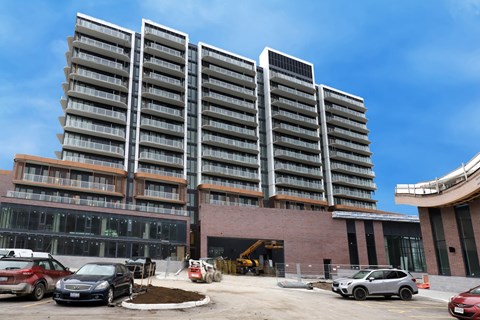 A large building with a parking lot in front of it.