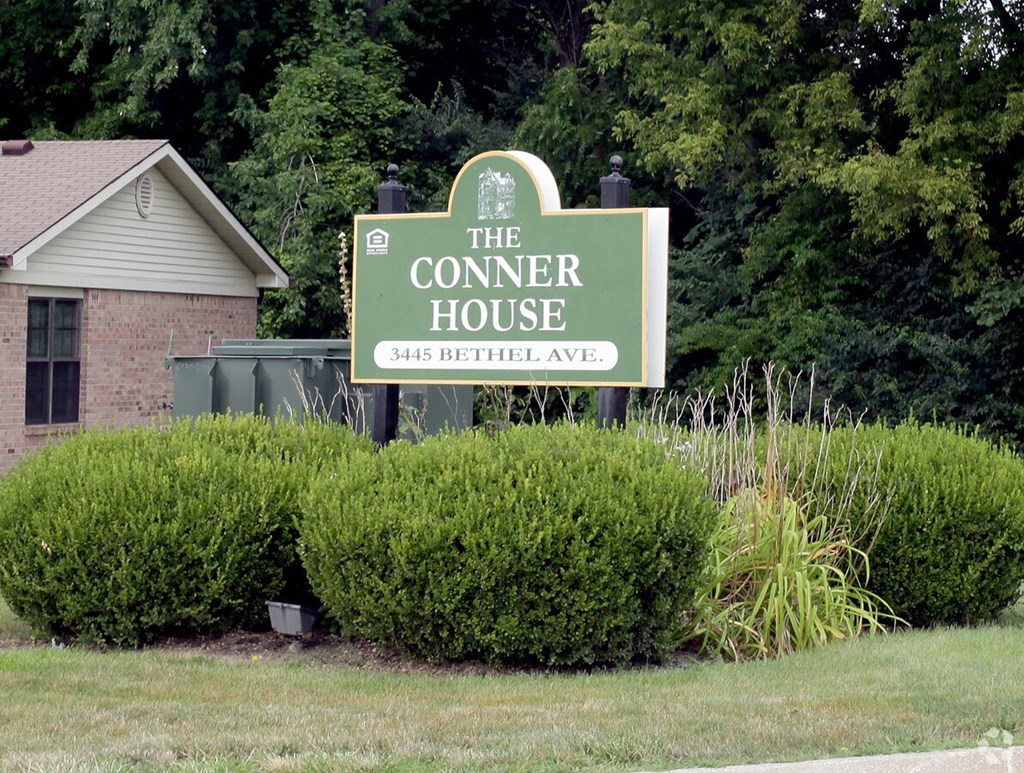 A green sign that says The Conner House on it.