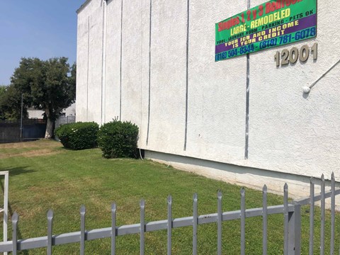 A sign on a building advertises large-scale remodeling services.