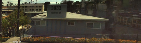 A grey building with the number 3933 on it.
