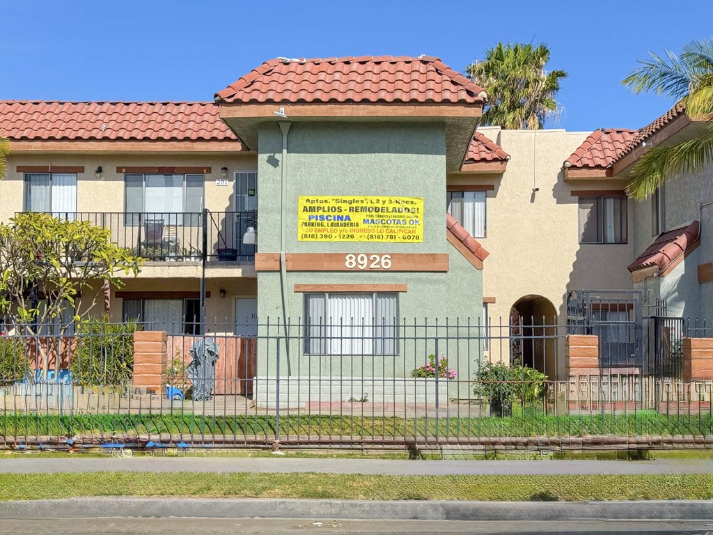 A building with a sign that says 8926 on it.