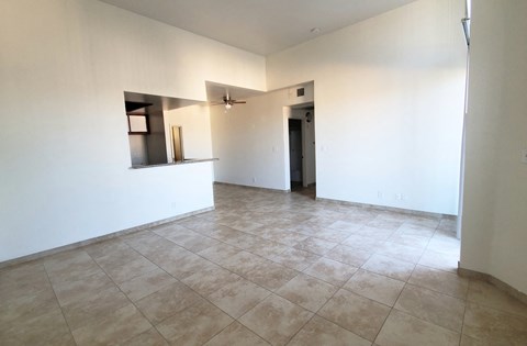 A room with a tiled floor and a ceiling fan.