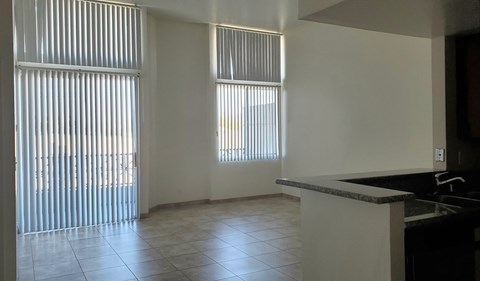 A kitchen with a counter and a sink.