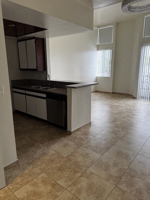 A kitchen with a sink and a counter.