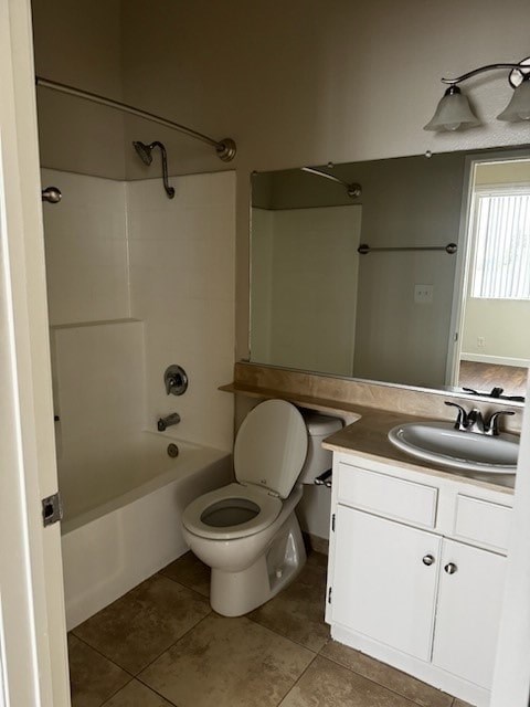 A white toilet in a bathroom with a sink and mirror.