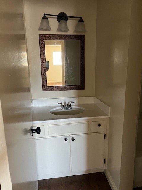 A bathroom with a sink and a mirror.